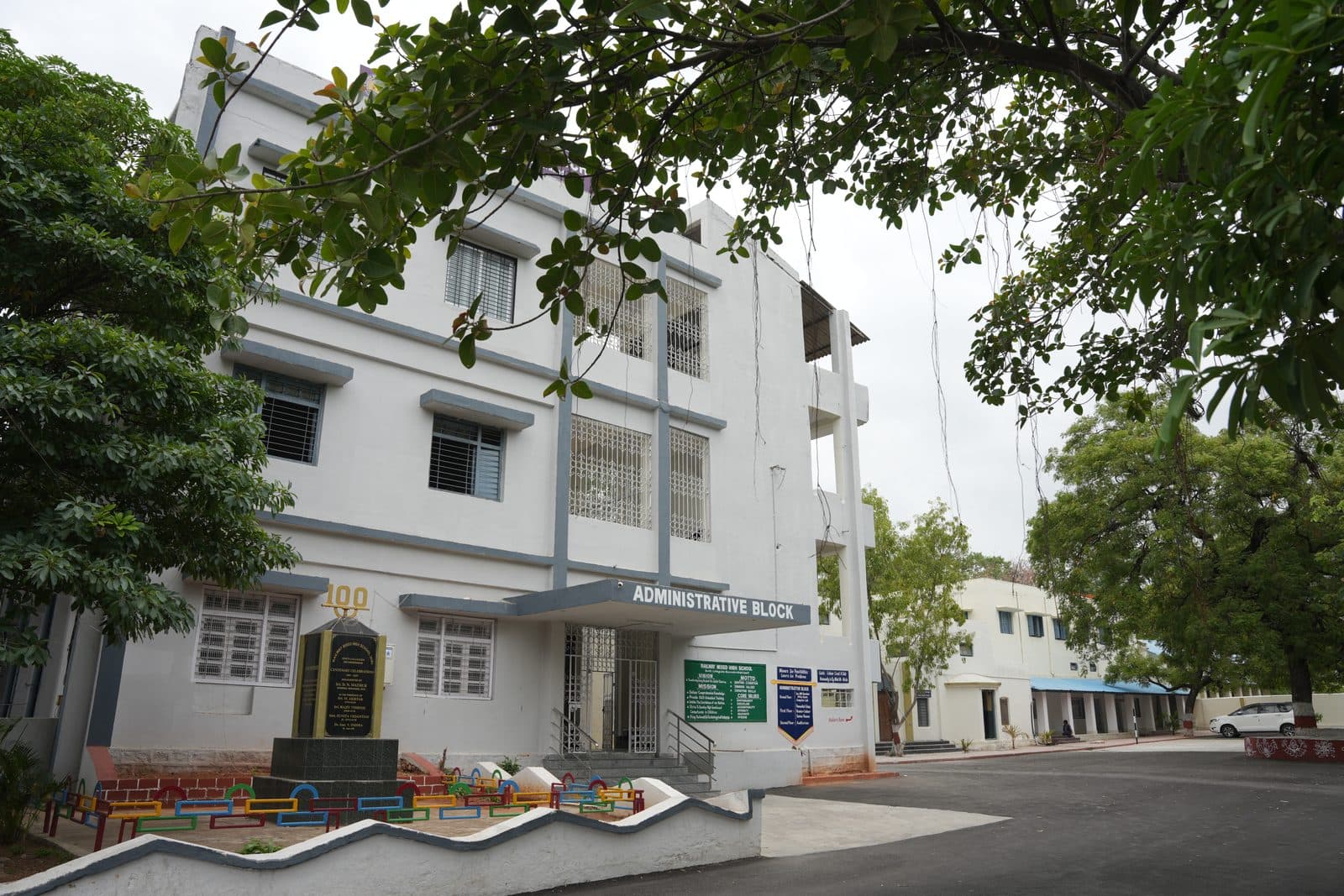 The three-storey Administrative Block with the school's centenary monument in front