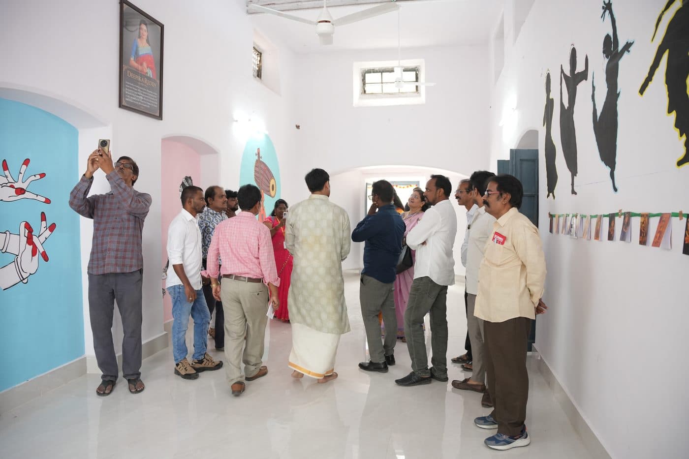 The dance studio, its walls painted with silhouettes of classical dancers